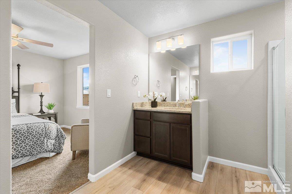 1164 Arrastra Road, Unit LOT 19 Reno, NV 89512 - Photo 23 of 34 a bathroom with a sink and a mirror