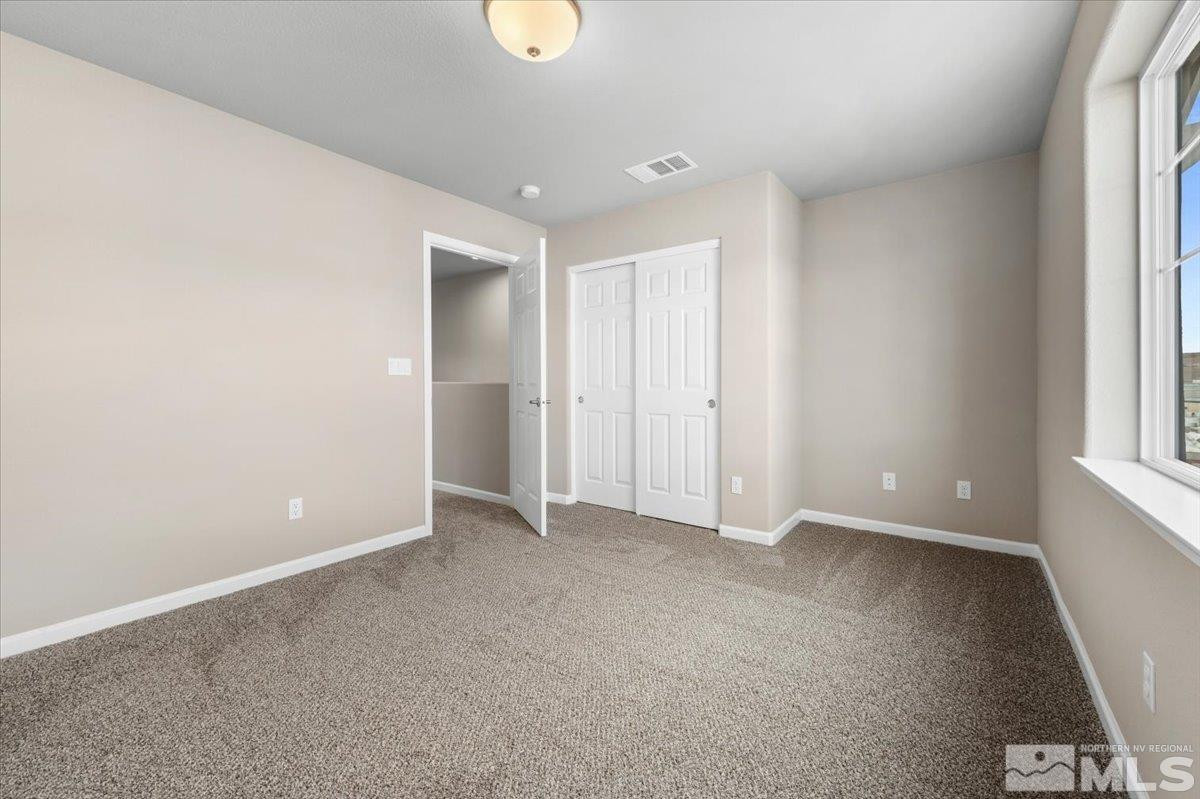 1164 Arrastra Road, Unit LOT 19 Reno, NV 89512 - Photo 28 of 34 an empty room with windows