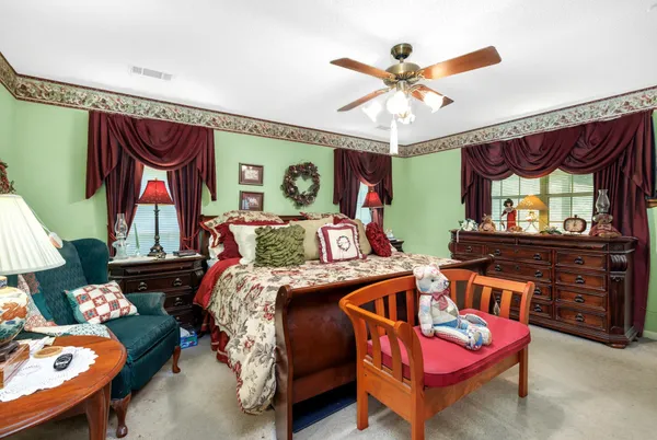 a bedroom with furniture and a window