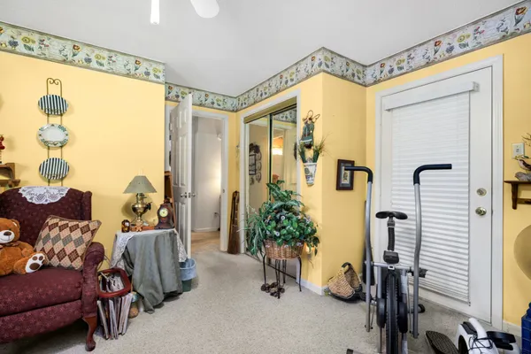 a bedroom with furniture and a window