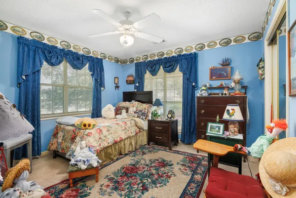 a bedroom with bed and a window