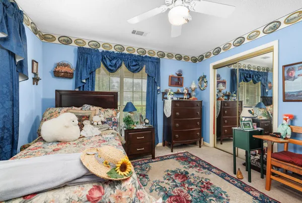 a bed room with furniture and a chandelier