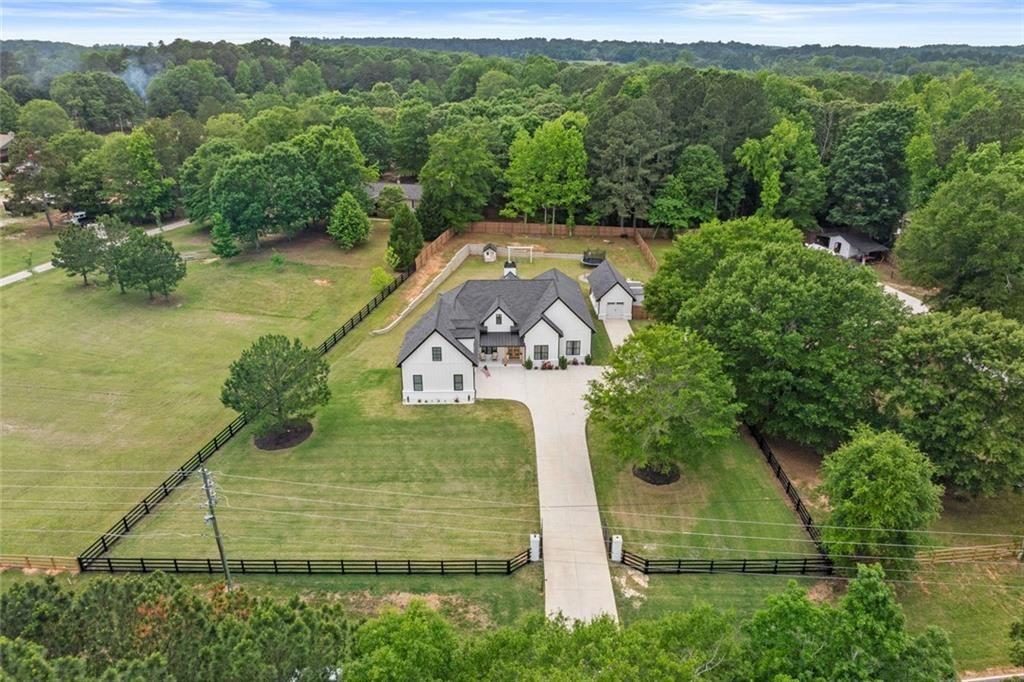 aerial view of a house with a yard