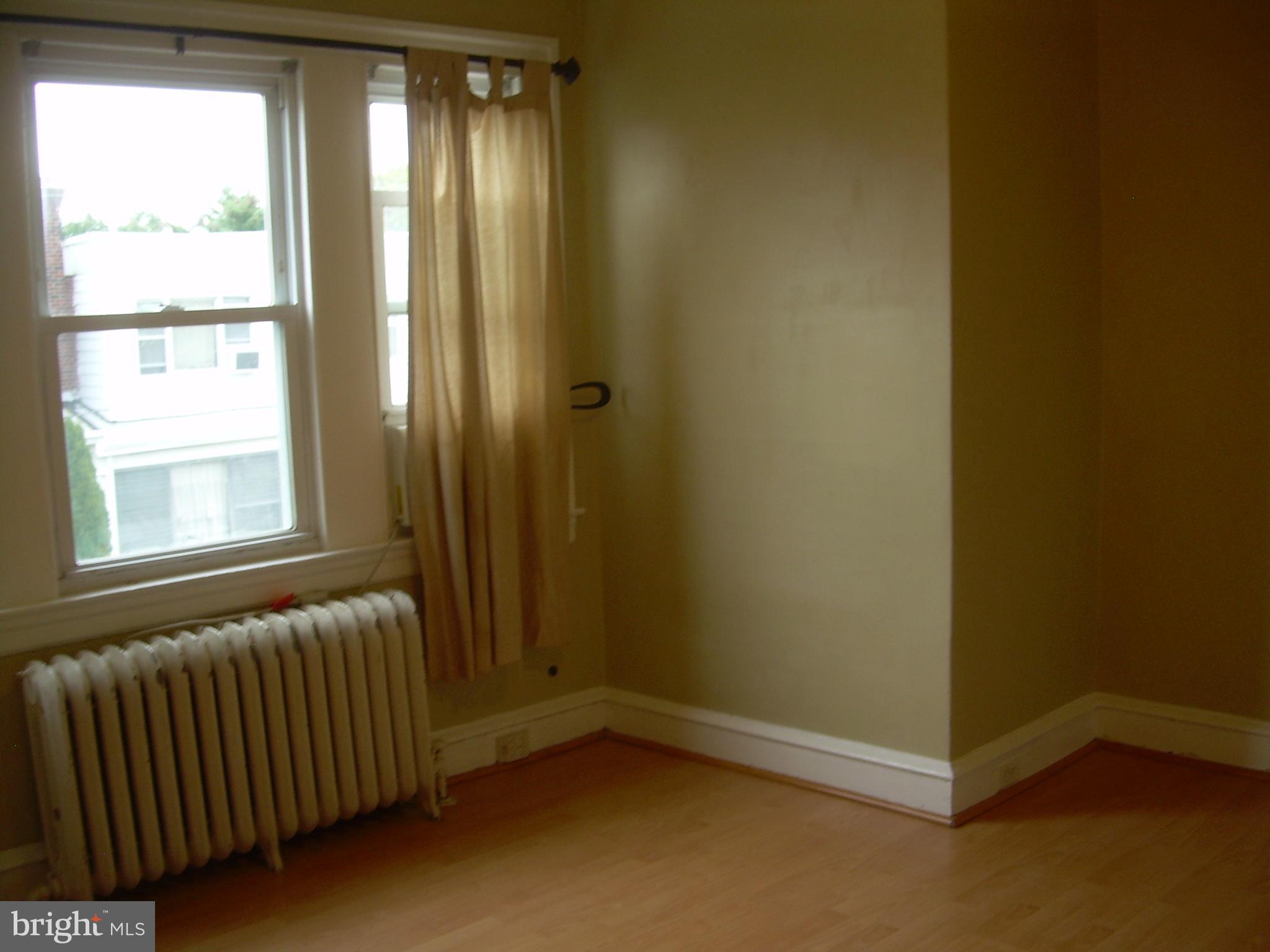 996 Anchor Street Philadelphia, PA 19124 - Photo 12 of 30 a view of an empty room and window