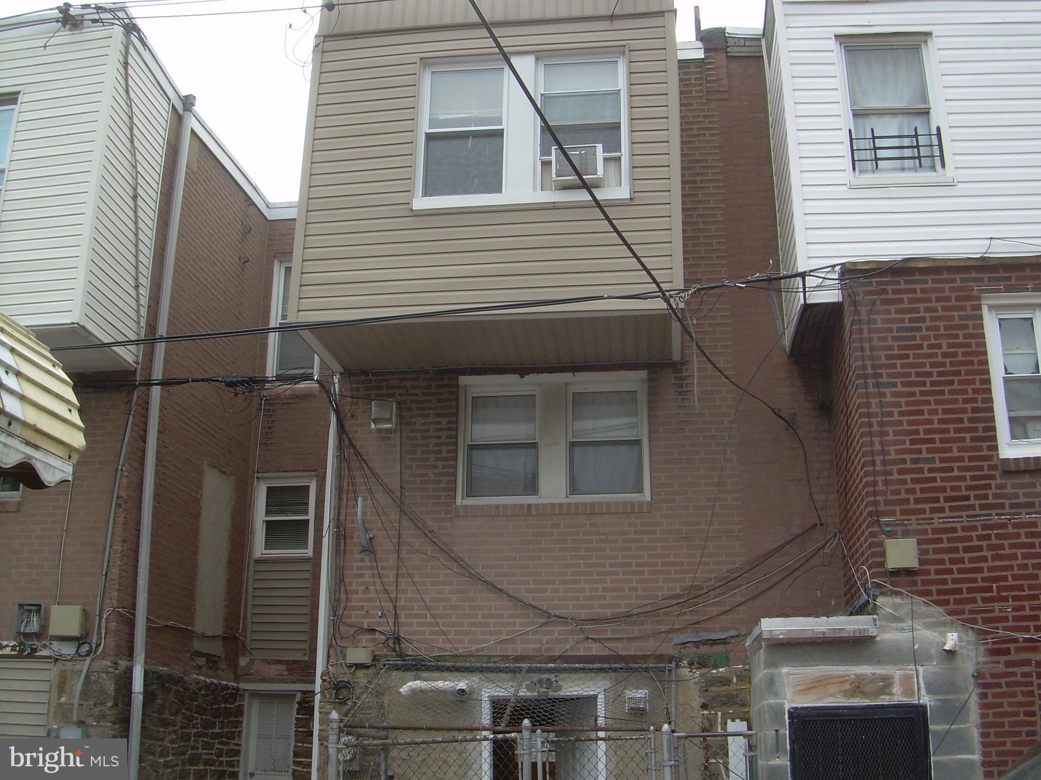 996 Anchor Street Philadelphia, PA 19124 - Photo 30 of 30 a view of a house with a door and wooden stairs