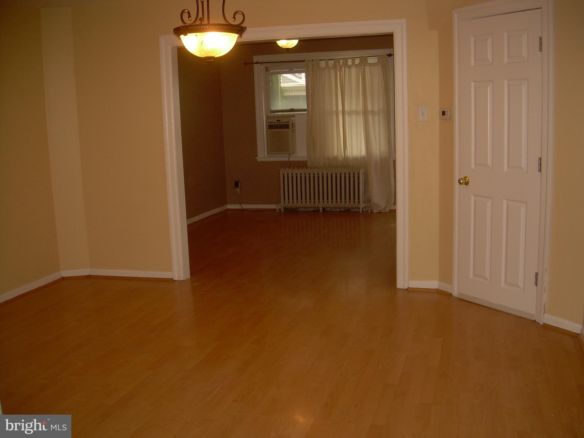 996 Anchor Street Philadelphia, PA 19124 - Photo 5 of 30 an empty room with windows and mirror