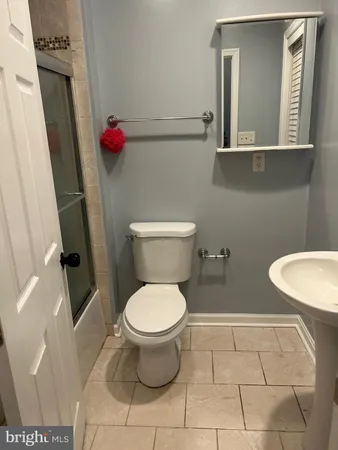 a bathroom with a toilet and a sink