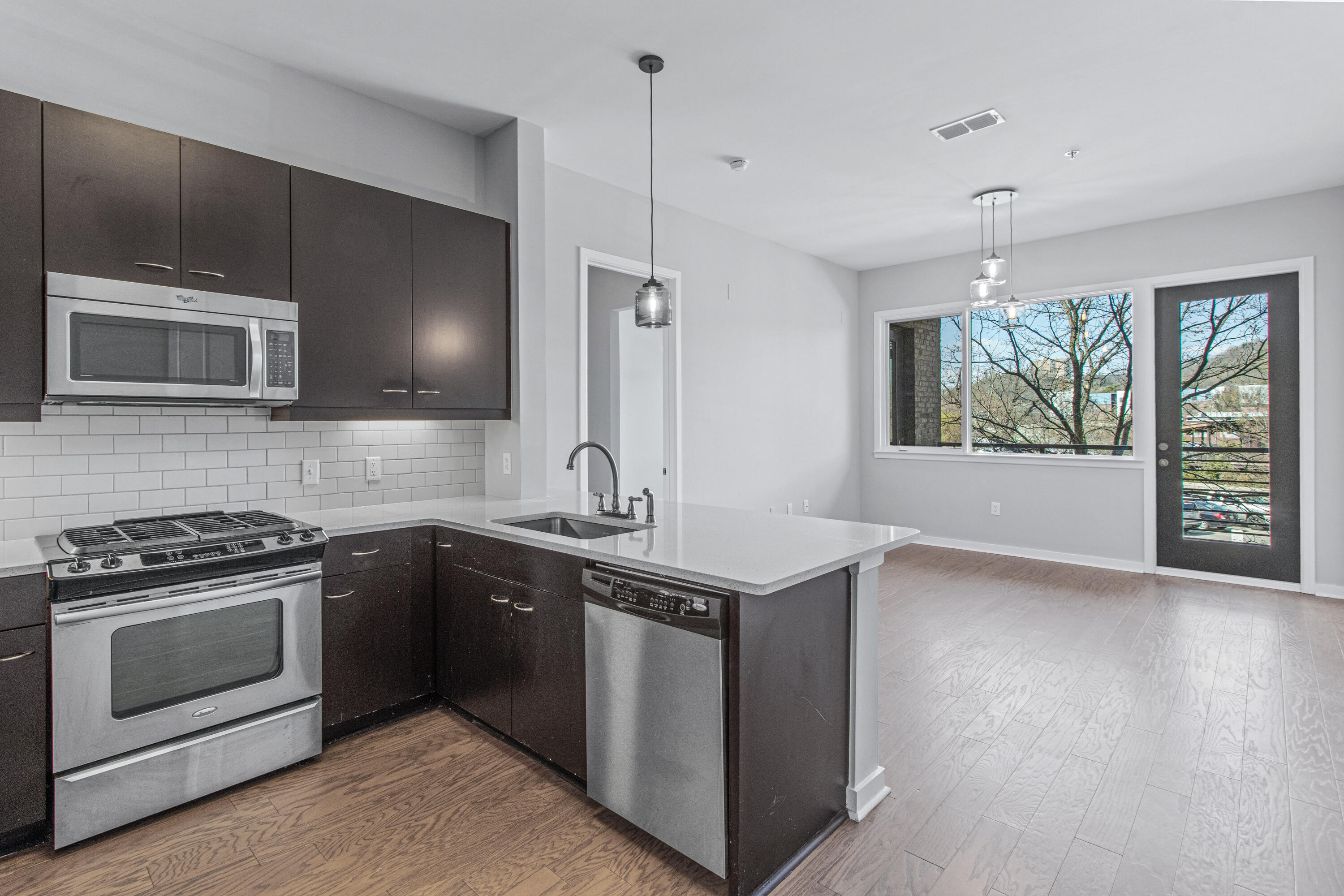 200 Manufacturers Road, Unit 235 Chattanooga, TN 37405 - Photo 6 of 23 Kitchen to Living Room
