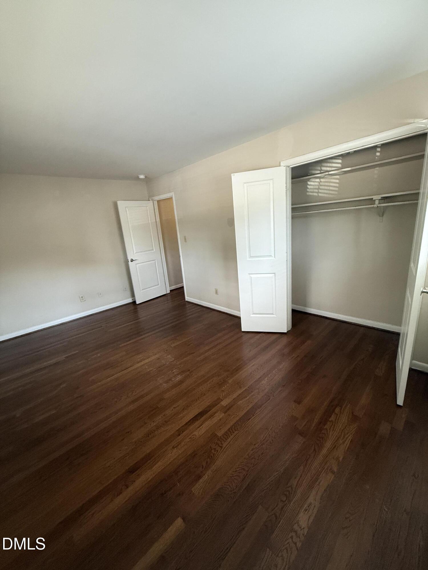 2616 Noble Road, Unit D Raleigh, NC 27608 - Photo 5 of 9 wooden floor in an empty room