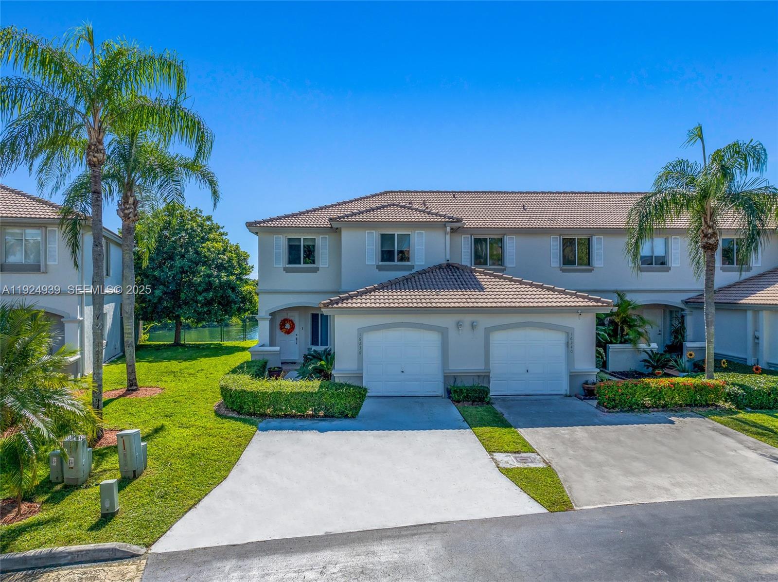 16236 Southwest 75th Street Miami, FL 33193 - Photo 19 of 53 a front view of a house with a yard