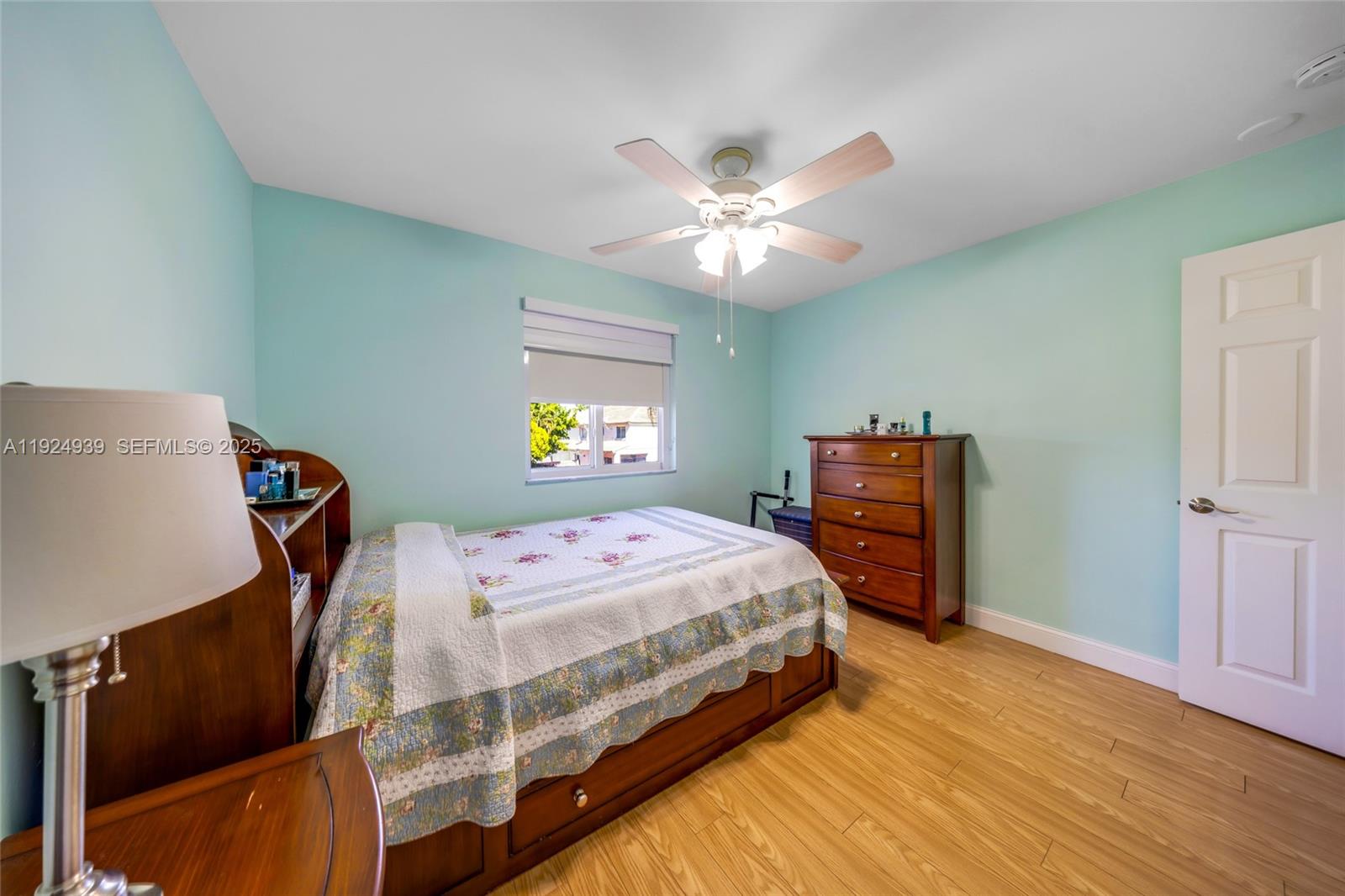16236 Southwest 75th Street Miami, FL 33193 - Photo 21 of 53 a bedroom with a bed and a chandelier