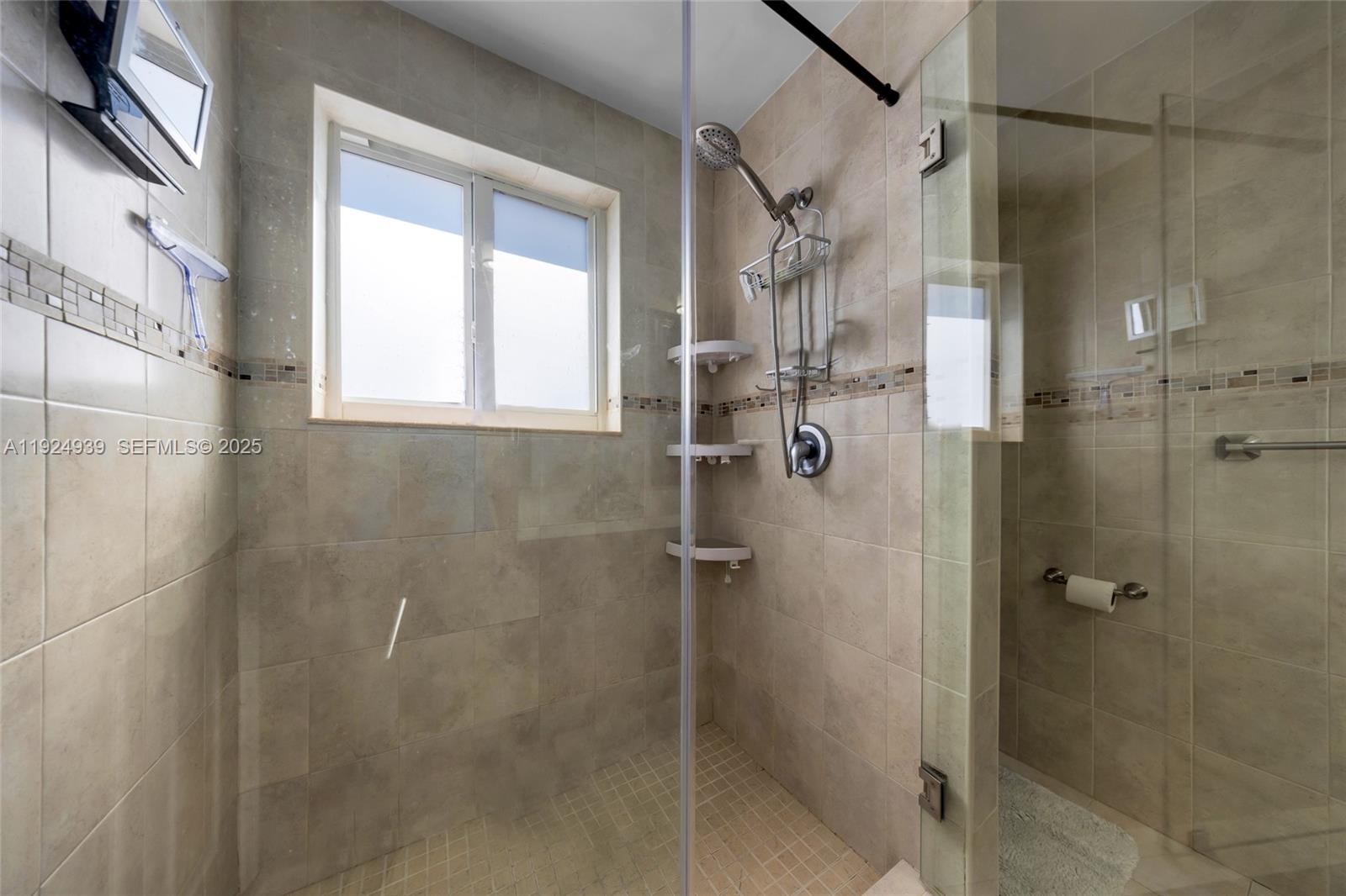16236 Southwest 75th Street Miami, FL 33193 - Photo 26 of 53 a bathroom with a shower