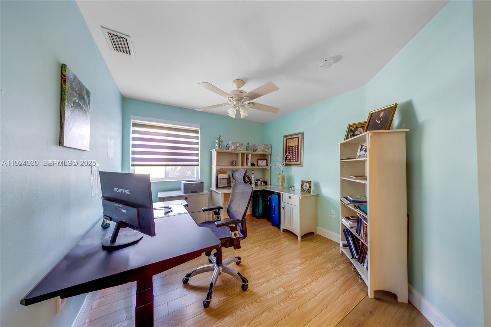16236 Southwest 75th Street Miami, FL 33193 - Photo 32 of 53 a view of a workspace with furniture and a window