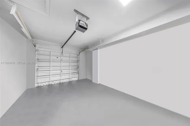 a view of a workspace with furniture and a kitchen