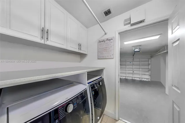 a open kitchen with stainless steel appliances granite countertop a refrigerator and a sink