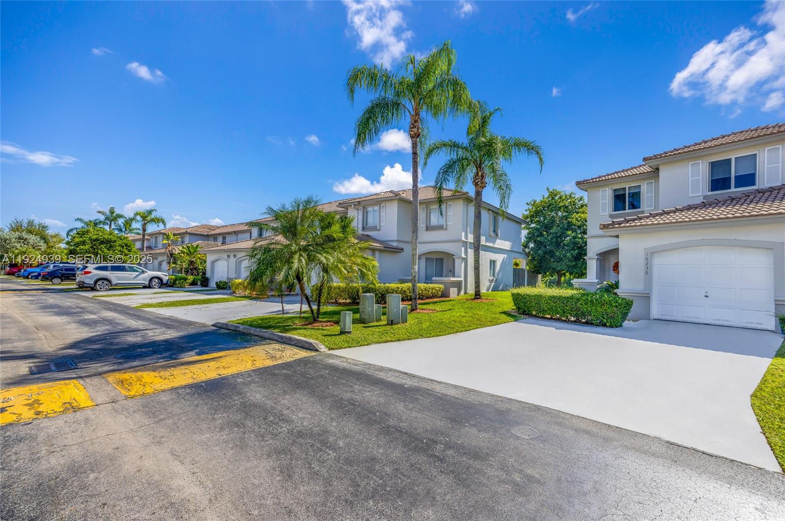 16236 Southwest 75th Street Miami, FL 33193 - Photo 4 of 53 a view of a house with swimming pool and a yard