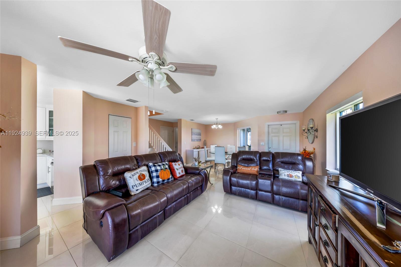 16236 Southwest 75th Street Miami, FL 33193 - Photo 42 of 53 a living room with furniture and a flat screen tv