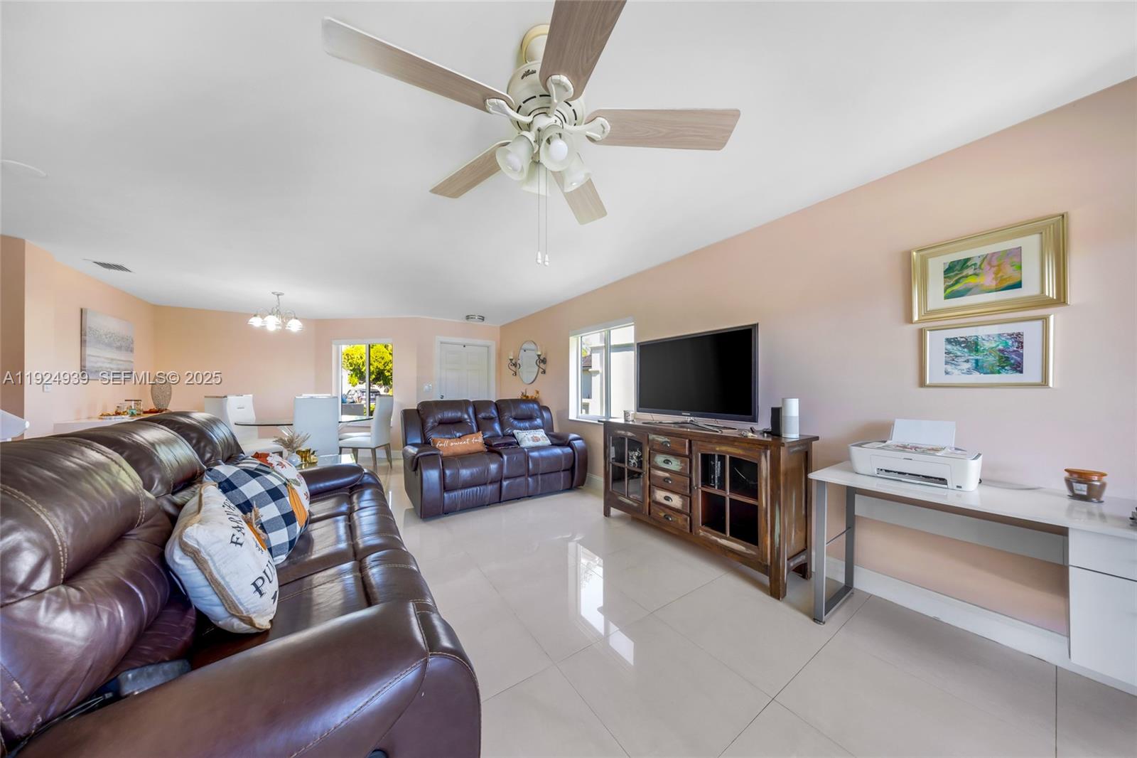 16236 Southwest 75th Street Miami, FL 33193 - Photo 44 of 53 a living room with furniture and a flat screen tv
