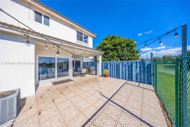 an aerial view of a house with a garden