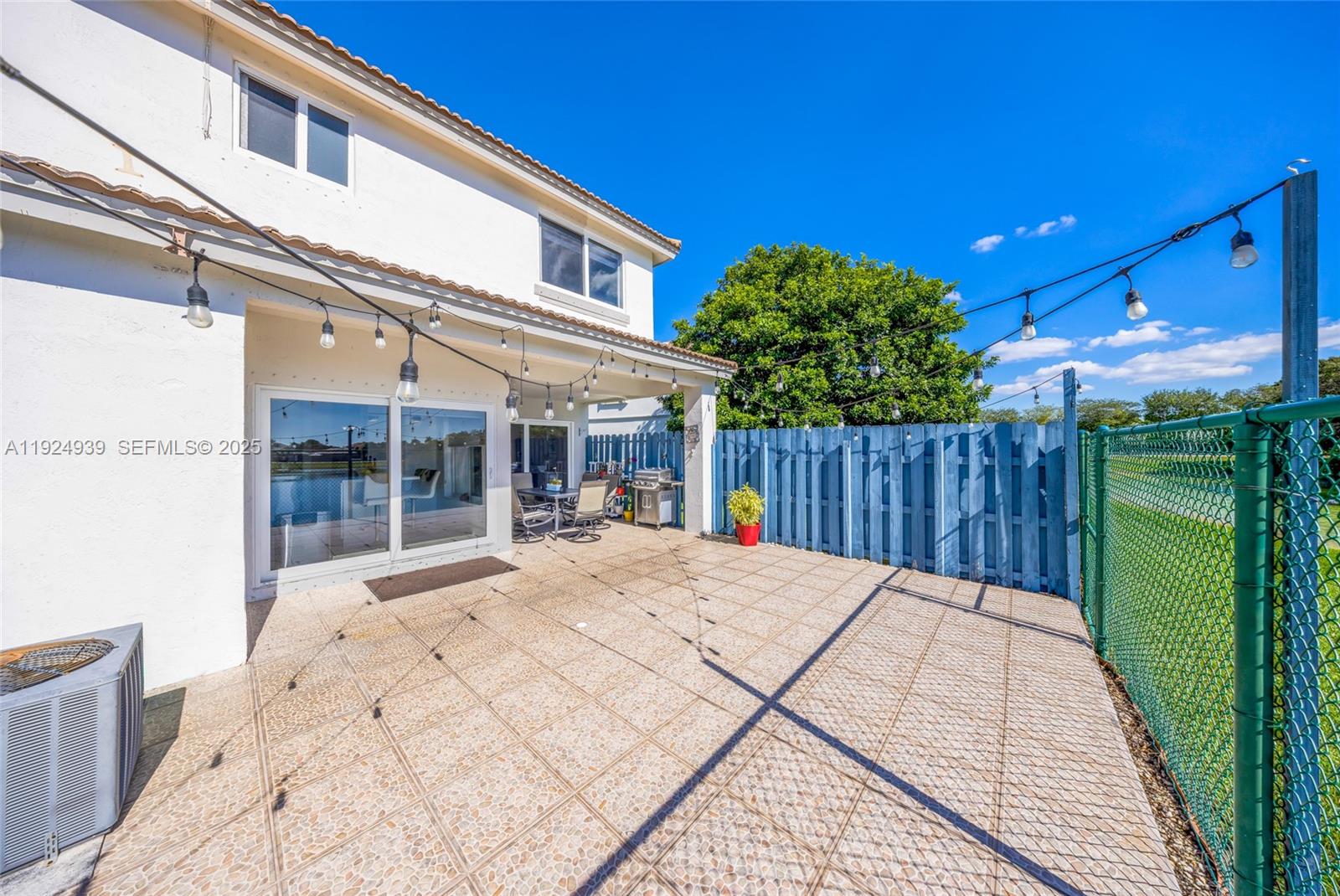 16236 Southwest 75th Street Miami, FL 33193 - Photo 49 of 53 a view of a house with a patio