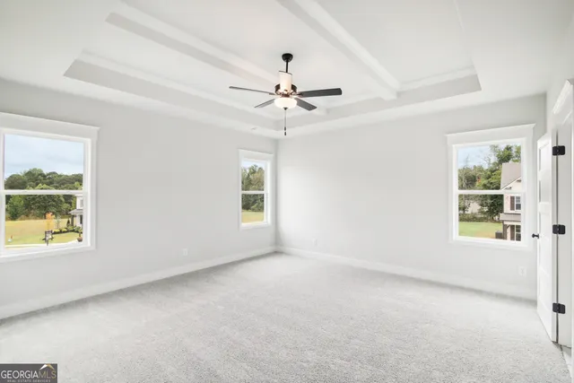 a view of a sign board with flower in front of it