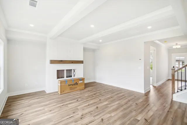 a kitchen with stainless steel appliances granite countertop a sink a refrigerator and a granite counter tops