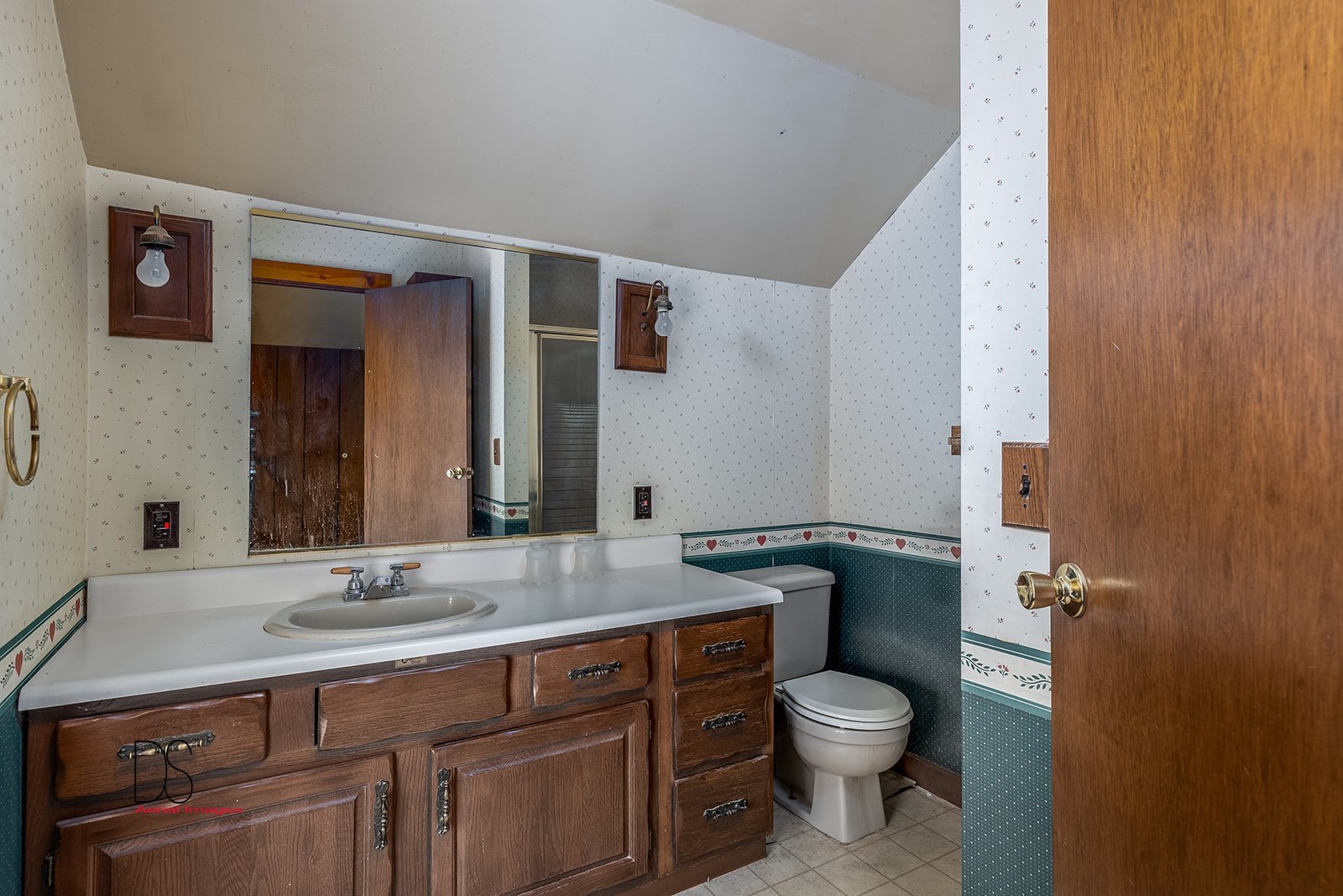 2113 Fields Place Ottawa, IL 61350 - Photo 13 of 28 a bathroom with a granite countertop toilet sink and mirror