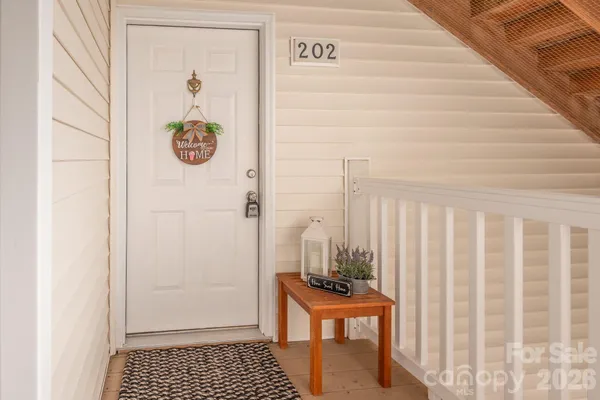 a view of an entryway with wooden floor