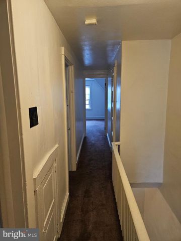 a bathroom with a sink mirror vanity and toilet