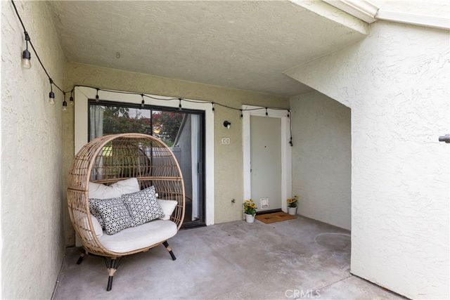a living room with furniture and a mirror
