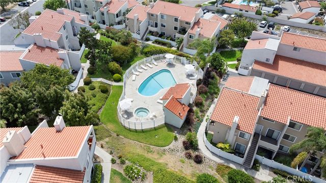 an aerial view of a house with outdoor space