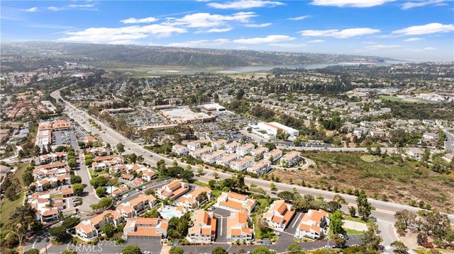an aerial view of residential building with city view