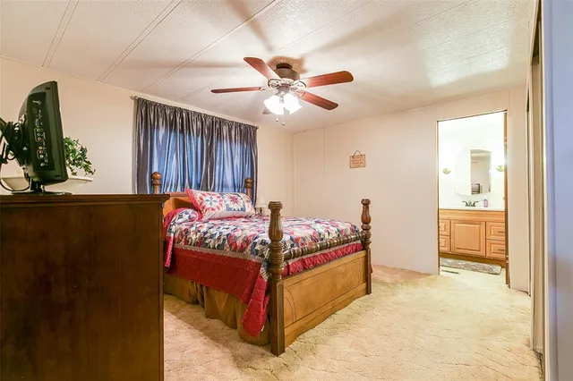 a bedroom with furniture and window