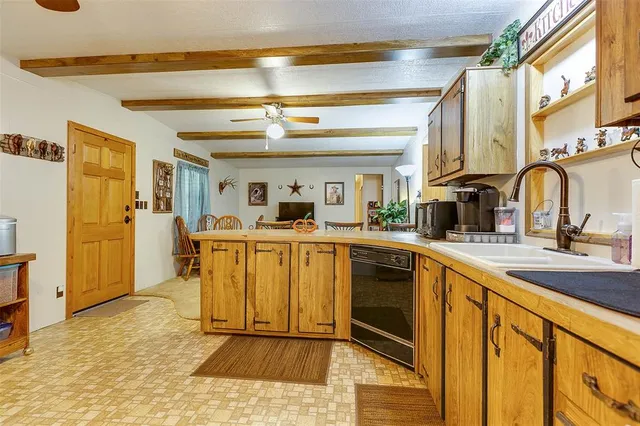 a view of a kitchen with a sink storage and utility