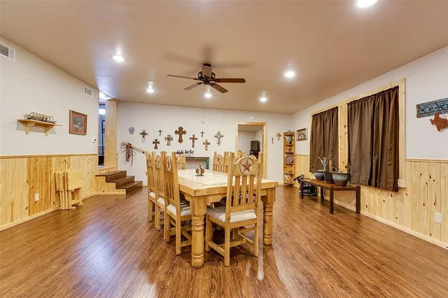 a view of a dining room with furniture and wooden floor