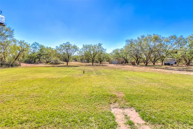 a backyard of a house with outdoor seating