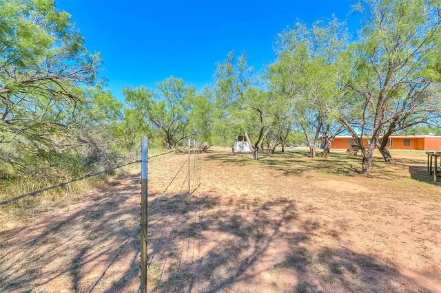 a view of a lake with houses in the back