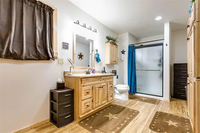 a bathroom with a sink a mirror and a shower