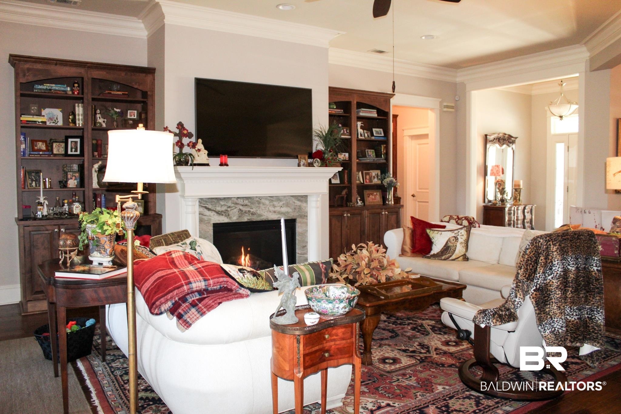 375 Barndling Street Fairhope, AL 36532 - Photo 3 of 24 Living room featuring a fireplace, hardwood / wood-style flooring, ceiling fan, and ornamental molding