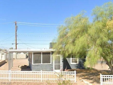 View of front of property featuring fence