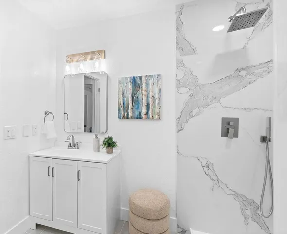 a bathroom with a sink and a shower