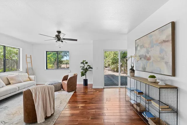 a bedroom with a bed and a painting on the wall