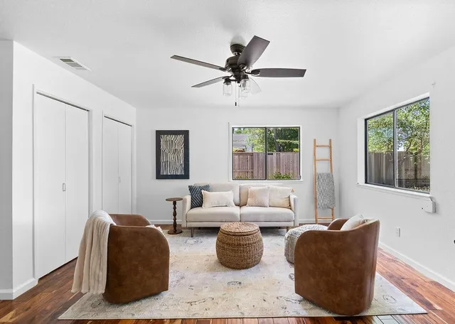 a bedroom with bed and a large mirror