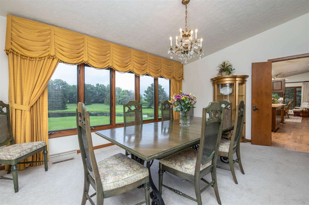 7676 Swanson Road Roscoe, IL 61073 - Photo 14 of 39 a view of a dining room with furniture window and outside view