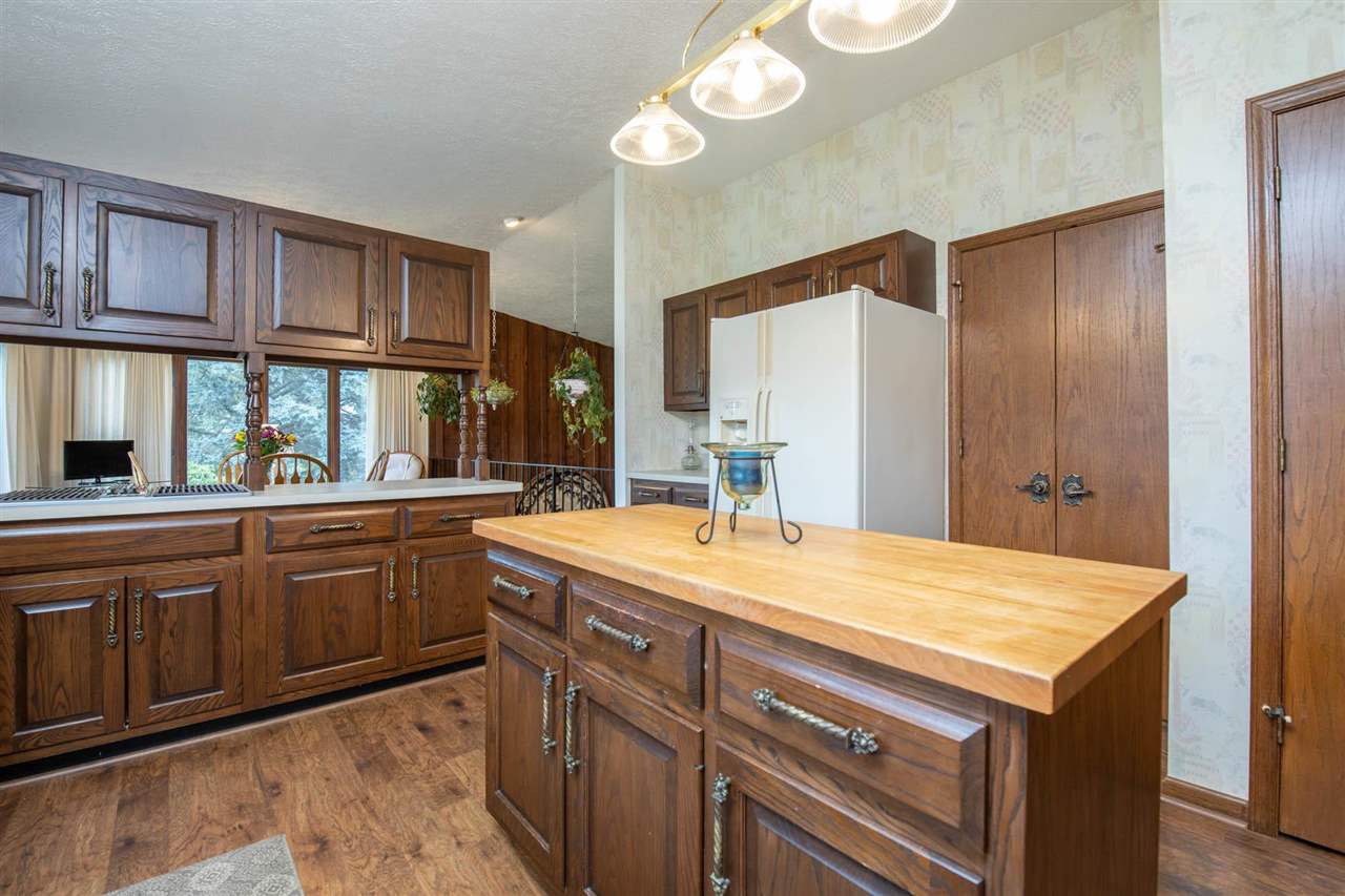 7676 Swanson Road Roscoe, IL 61073 - Photo 16 of 39 a bathroom with a granite countertop sink and a large mirror