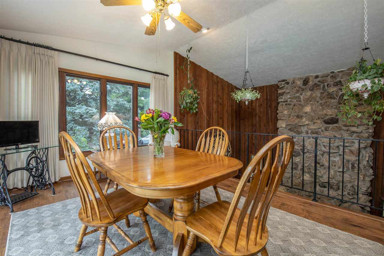 7676 Swanson Road Roscoe, IL 61073 - Photo 18 of 39 a view of a dining room with furniture window and outside view
