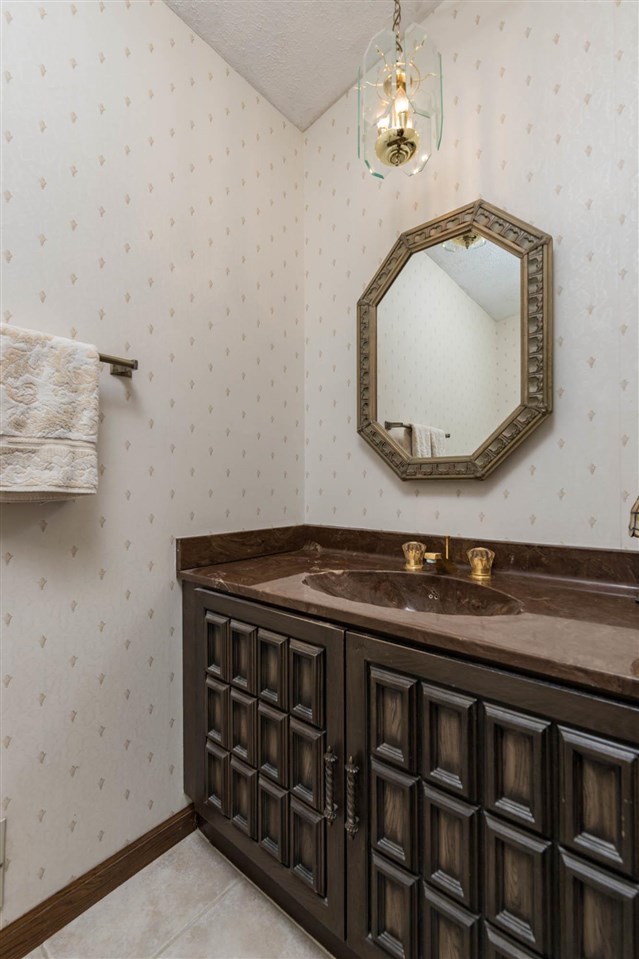 7676 Swanson Road Roscoe, IL 61073 - Photo 20 of 39 a bathroom with a sink and a mirror