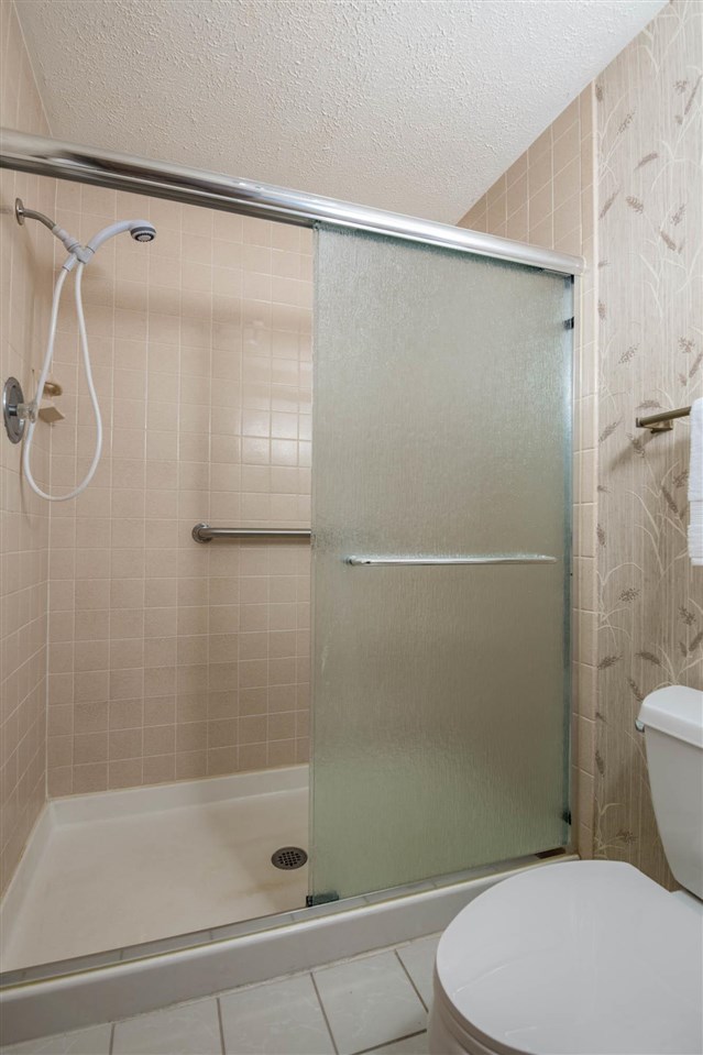 7676 Swanson Road Roscoe, IL 61073 - Photo 24 of 39 a bathroom with a shower and a toilet
