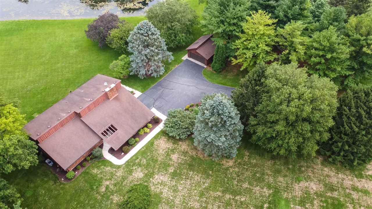 7676 Swanson Road Roscoe, IL 61073 - Photo 3 of 39 an aerial view of a house with garden space and street view
