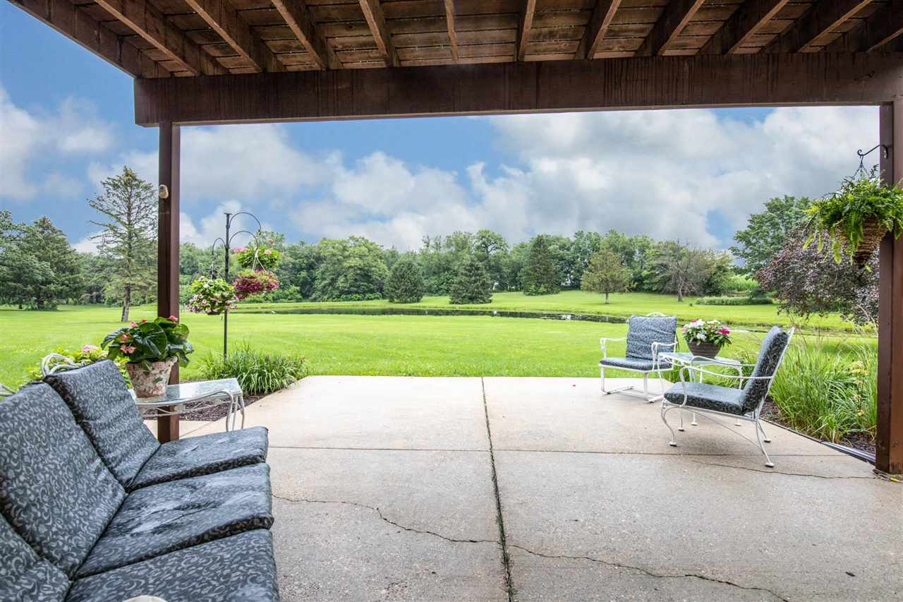 7676 Swanson Road Roscoe, IL 61073 - Photo 36 of 39 a view of a garden with a patio